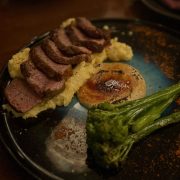 French-style 200gr Sabanah aged Eye Fillet a la Mustard flambeed with Brown Sugar and Mustard Sauce / Creamy polenta / Seasonal Vegetable